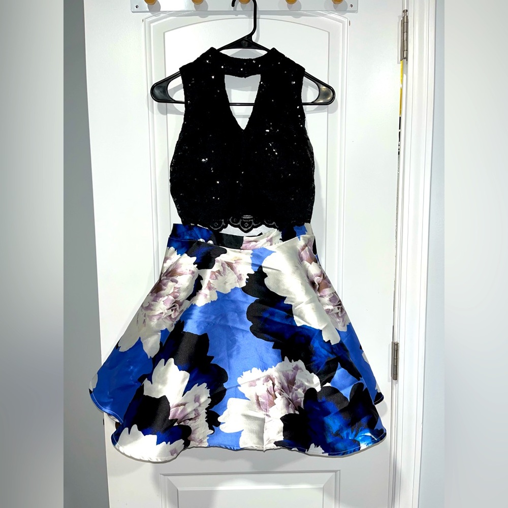City triangles, size 3, 2 piece black top with blue and white floral skirt